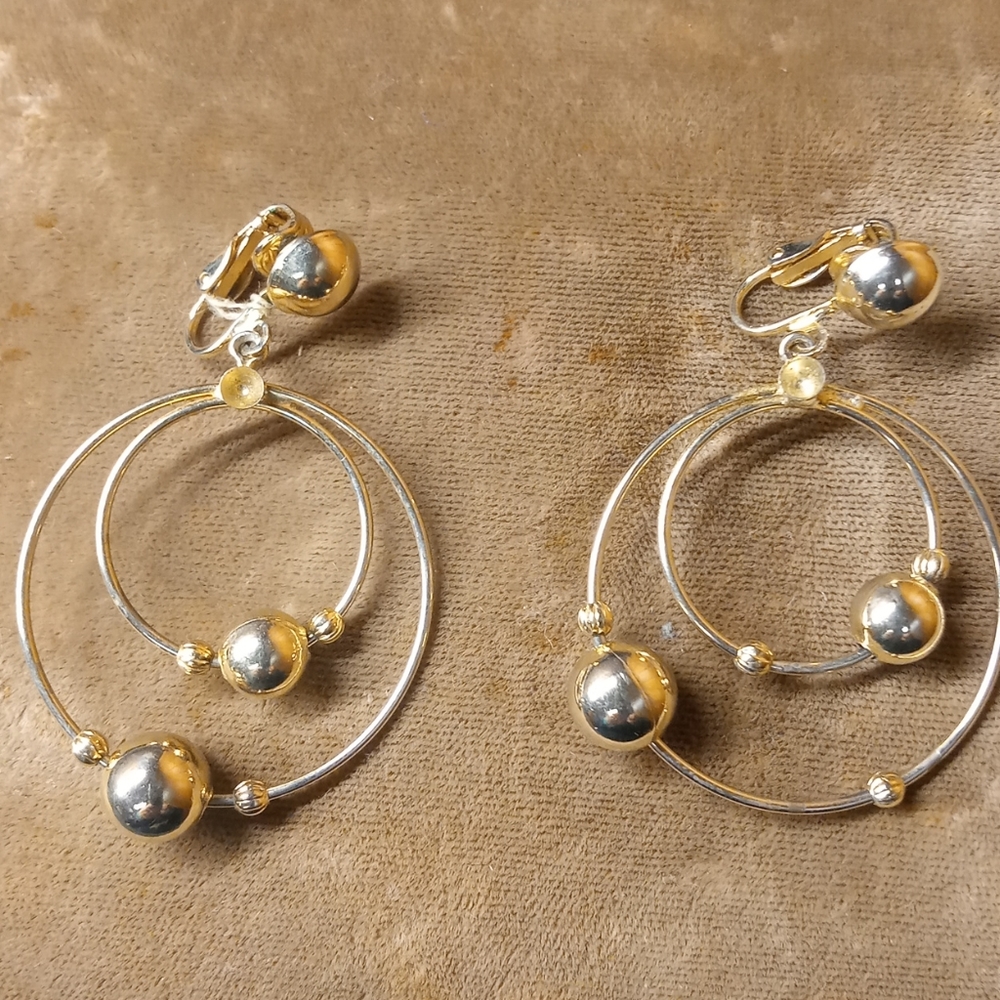 Pair of clasp hoop earrings. Costume jewerly
